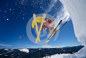 skiers-launching-off-snow-bank-hitting-slopes-low-angle-view-two-33913953[1]